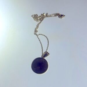 Gold link chain with a gold plate charm